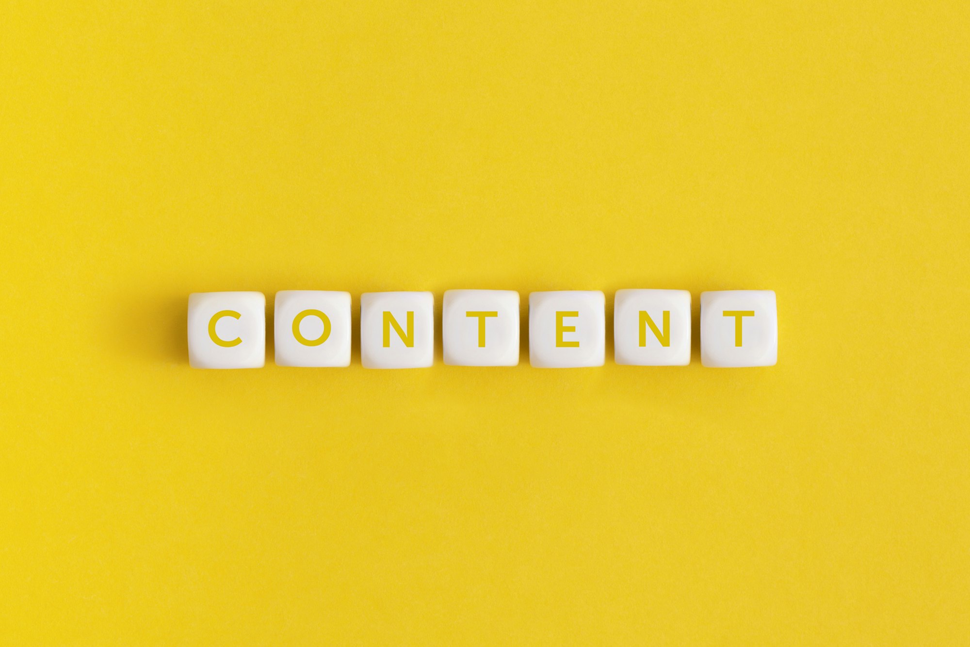 The word "Content on a white cubes